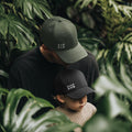 Matching black and sage green minimalist family caps for dads and kids by SML Batch