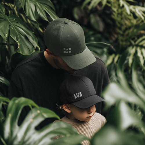Matching black and sage green minimalist family caps for dads and kids by SML Batch